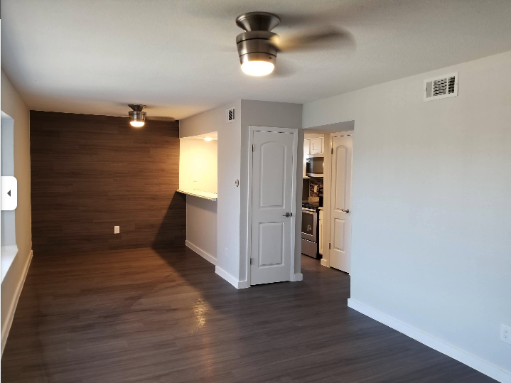 Residential Flooring - Dark Wood Installation with Accent Wall